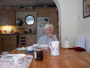 Photo of older woman eating breakfast