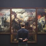 Man standing in front of an artwork