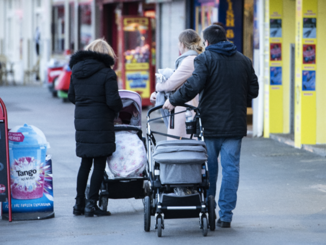 group of people with buggies in UK street