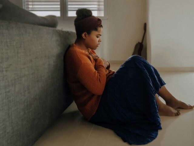 Female sitting on floor