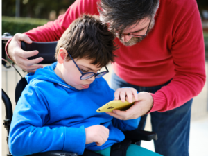 Photo of father caring for disabled child