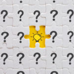 Design of question marks with a lightbulb in the middle.