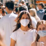 People wearing masks in the street during the pandemic